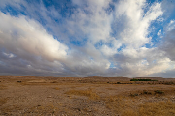 Fototapeta na wymiar Majestic wide panorama of morning clouds over Negev desert