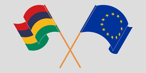 Crossed and waving flags of Mauritius and the EU