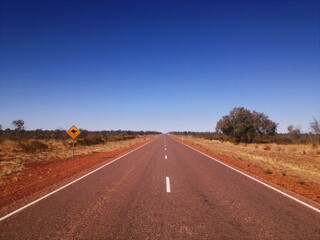 Fototapeta na wymiar The long straight roads of the Australian outback