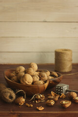 Walnuts lie on the table in the rustic kitchen