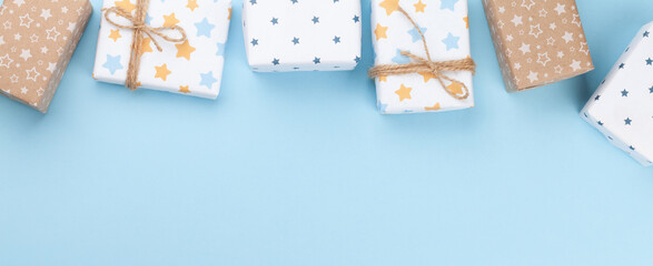 Christmas gift boxes over blue background