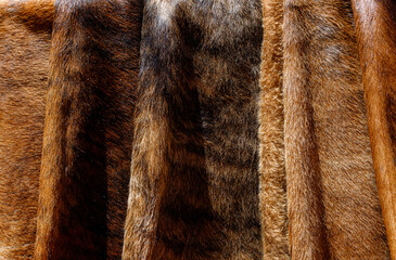 Macro closeup of several folded cow hides with natural light