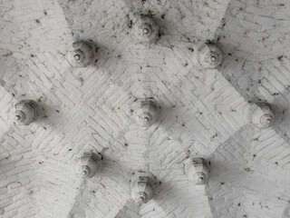 pattern on a celing decorated with white painted bricks