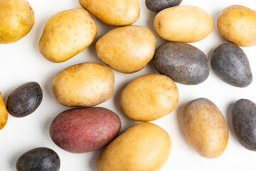 Assorted Color Potatoes On Flat White Surface Table