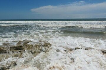 Ocean waves break against rocks in Atlantic coast of North Florida