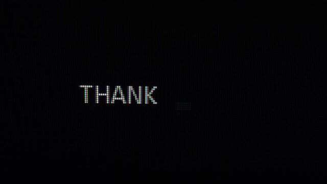 Typing of phrase Thank you on dark background. Close up 4K footage