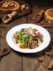 Roast beef salad with vegetables and greens 