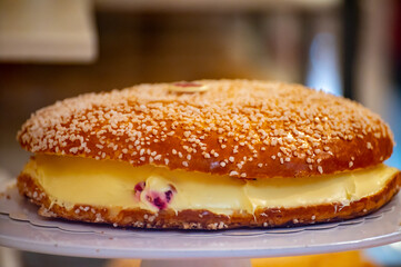 French fresh baked sweet filled brioche pastry tarte tropezienne in confectionery shop in Saint-Tropez, Provence, France