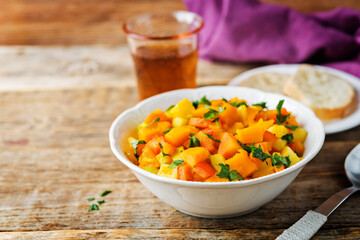 Pumpkin potato carrot stew in the bowl
