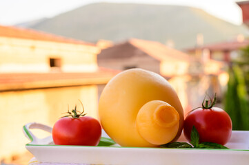 Cheese collection, Italian cheese provolone or caciocavallo made from sheep or cow milk in South Italy, yellow smoked.