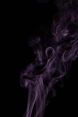 purple smoke from incense on a black background