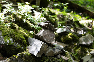 A stack of stones stands on top of each other. Mysterious ritual