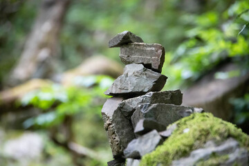 A stack of stones stands on top of each other. Mysterious ritual
