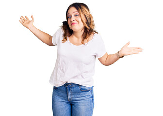 Young beautiful caucasian woman wearing casual white tshirt clueless and confused expression with...