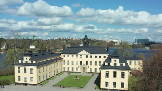 Most beautiful swedish castle or palace in aerial drone shot. Sweden flag
