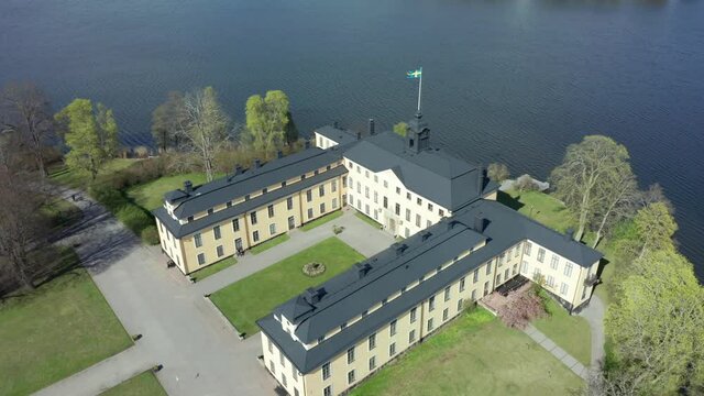 Castle royal palace by lake water. Building aerial drone in National City Park