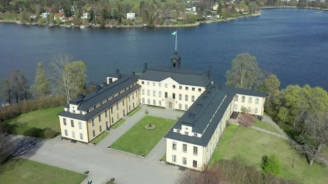 Royal Castle or palace in aerial drone shot. View over park landscaped garden