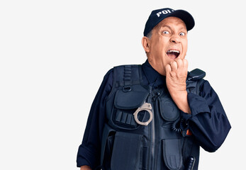 Senior handsome man wearing police uniform looking stressed and nervous with hands on mouth biting nails. anxiety problem.