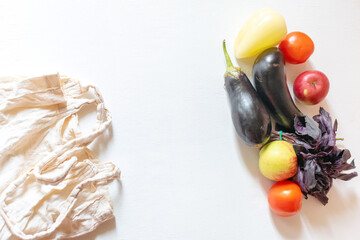 vegan grocery products and reusable bag on flat lay background. fresh healthy vegetables concept