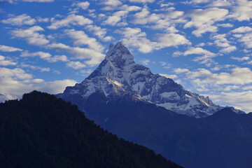 Machapuchare (Fish tail) mountain. Impressive peak with dramatic, beautiful cloud formations. Holy mountain.