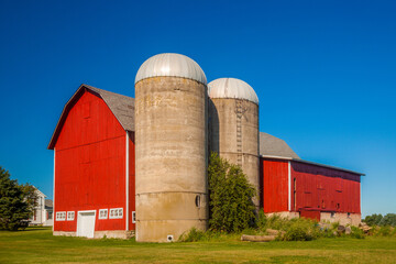 Red barn and twin silos in rural America