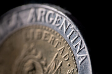 Close-up of an One Peso coin from Argentina isolated.