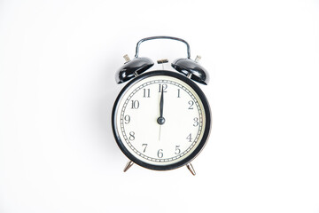 alarm clock on white 12:00 