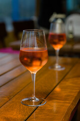 Two glasses with rose wine dewy.