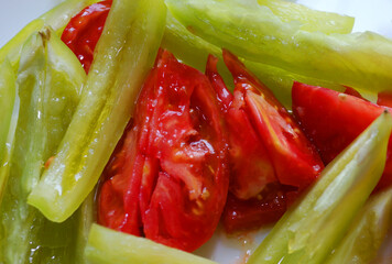 Sliced tomatoes and sweet peppers.