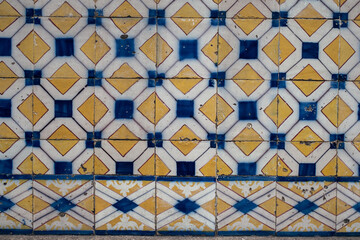 Traditional old tiles wall on the street Portuguese painted tin-glazed, azulejos ceramic tilework. Porto, Portugal.