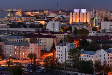 Aerial view of illuminated evening cityscape