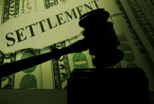 Judge Legal Gavel With Money And Settlement Text