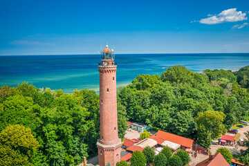 Aerial view of lighthouse on sunrise by Baltic Sea