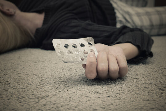 A Woman Committed Suicide By Overdosing And Died On The Floor With Empty Blister Of Pills, Suicide And Depression Concept, Major Depressive Disorder