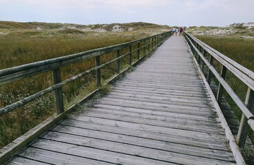 Fototapeta na wymiar wooden bridge to the beach
