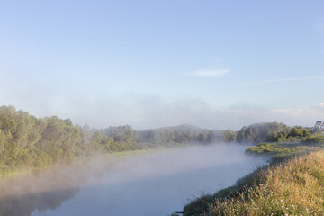 Fototapeta na wymiar fog over the river at dawn