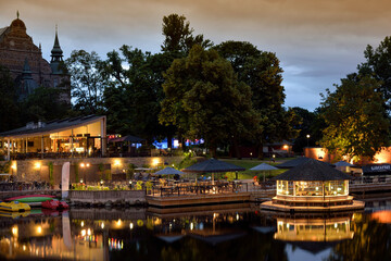 Urban park near water at evening time in Stockholm, Sweden