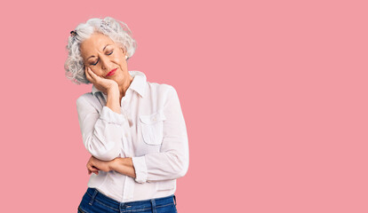 Senior grey-haired woman wearing casual clothes thinking looking tired and bored with depression problems with crossed arms.