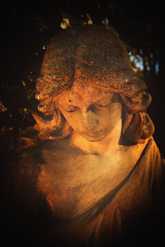 Close up beautiful angel. Ancient statue. Vertical image.
