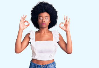 Young african american woman wearing casual clothes relax and smiling with eyes closed doing...