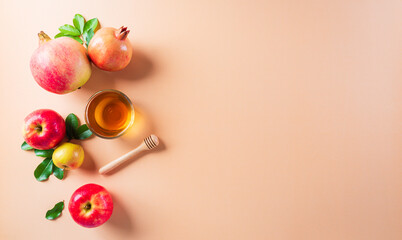 Rosh Hashanah (Jewish New Year holiday), Concept of traditional or religion symbols on pastel orange paper background.