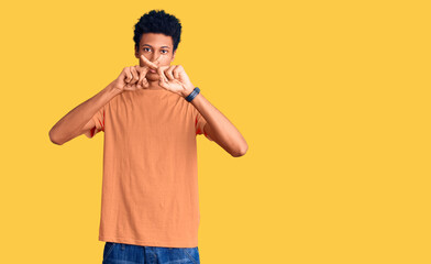 Young african american man wearing casual clothes rejection expression crossing fingers doing negative sign