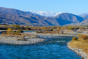 Natural landscape in Chuy and Issyk-Kul Province. Chong Kemin River flowing and snow capped...