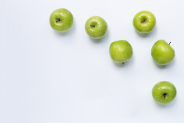 Green apples on white background. Copy space