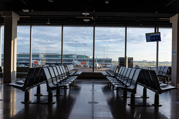 Empty airport departure lounge during pandemic. Amsterdam, Airport Schiphol, Netherlands. 