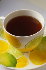 Hot herbal tea in a bright, colorful cup.