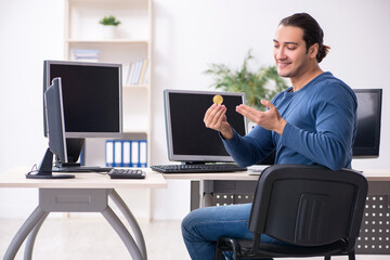 Young male it specialist working in the office