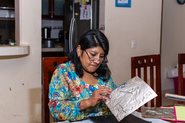 woman making an embossed frame