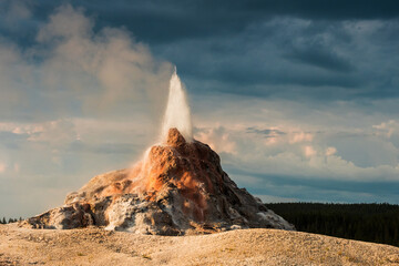White dome geyser erupting along Firehole lake drive