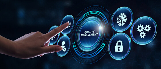 Businessman pressing quality management button on virtual screens. Business, Technology, Internet and network concept.
